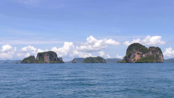 istock Exotic scenery islands with cloudscape and calm waters 1313825192