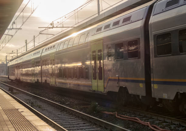 istock train on platform at the railway station. 1313825443