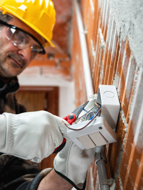istock Electrician at work in an electrical system of a construction site. Construction industry. 1313827549