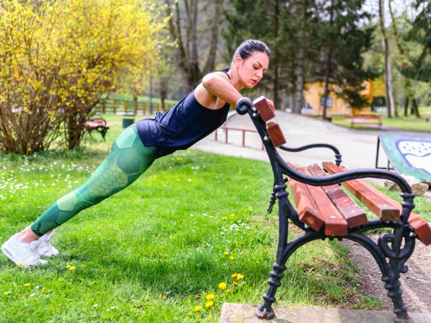 istock Sportswoman doing push ups outdoors 1313828703