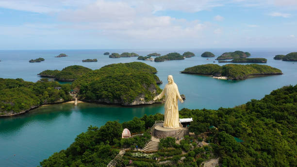 Hundred Islands National Park, Pangasinan, Philippines Aerial view of the hundred Islands national Park and the statue of Jesus Christ on top of the island, Pangasinan, Philippines. Cluster of Islands with beaches and lagoons, famous tourist attraction, Alaminos. pangasinan stock pictures, royalty-free photos & images