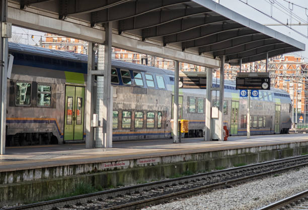 istock train on platform at the railway station. 1313830181