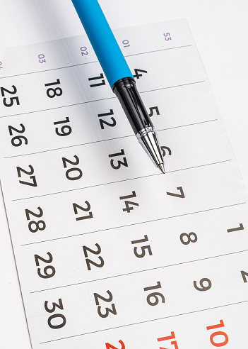 November  2023 - closeup of a small desktop calendar with a pen, time and business concept