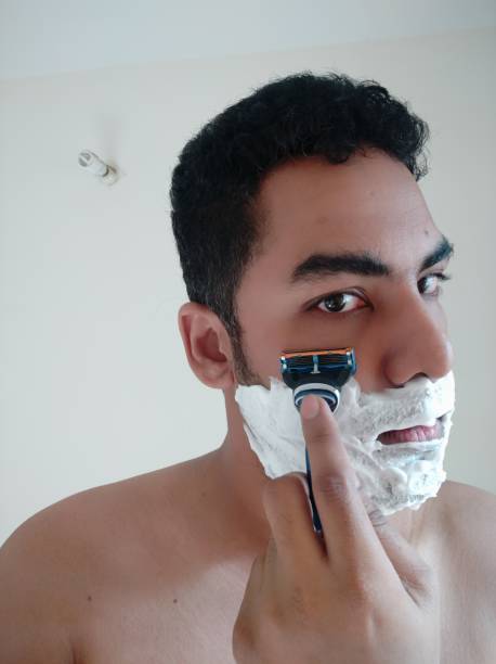 istock Shaving process of a indian men 1313832702