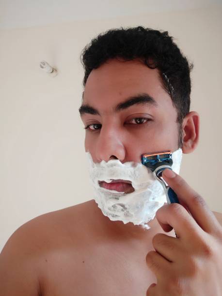 istock Shaving process of a indian men 1313832805