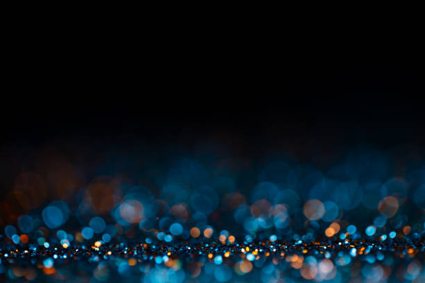 Decoration twinkle glitters background, abstract shiny backdrop with circles,modern design wallpaper with sparkling glimmers. Black, blue and golden backdrop glittering sparks with blur effect. Decoration twinkle glitters background, abstract shiny backdrop with circles,modern design wallpaper with sparkling glimmers. Black, blue and golden backdrop glittering sparks with blur effect dark blue stock pictures, royalty-free photos & images