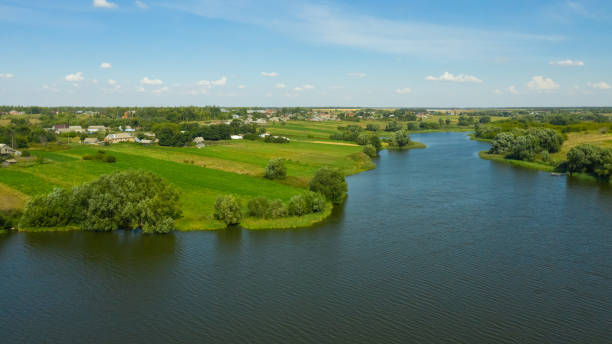 istock Rustic landscape with river. Rural landscape in summer 1313832980