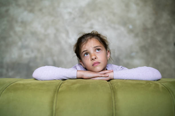 istock Little girl looking sad 1313833894