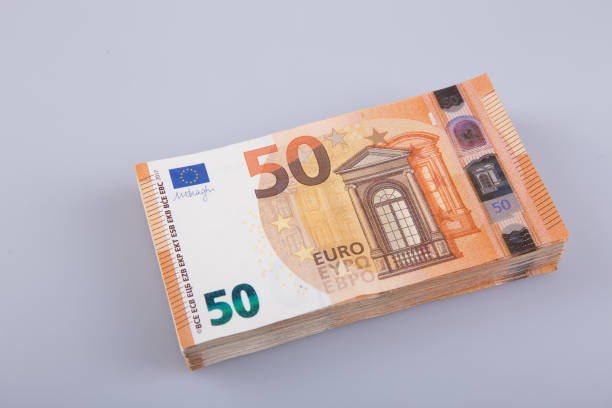 istock A stack of clear 50 euro banknotes on a gray background. 1313834345