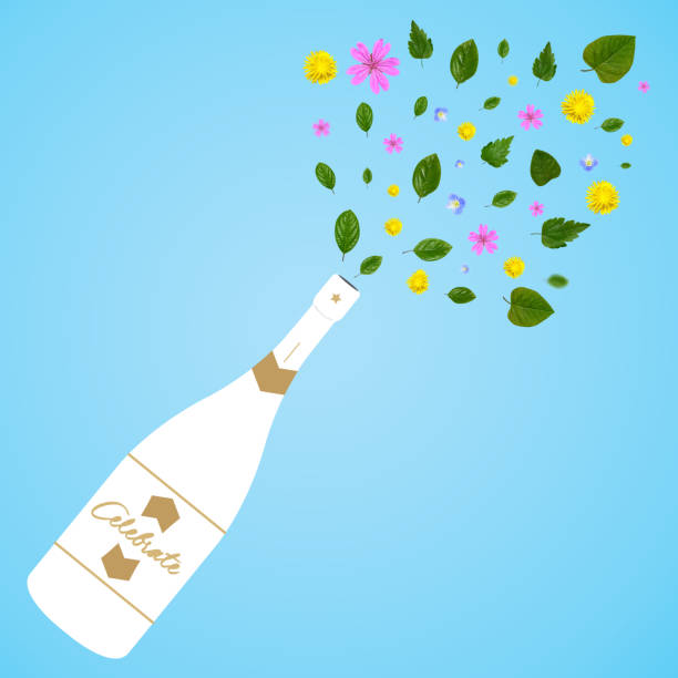 A bottle of champagne with spring flowers on a light blue background. Minimal concept for parties.