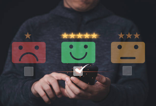 istock Businessman using mobile and touching to smiley face for customer survey product and service , Customer satisfaction and evaluation concept. 1313834672