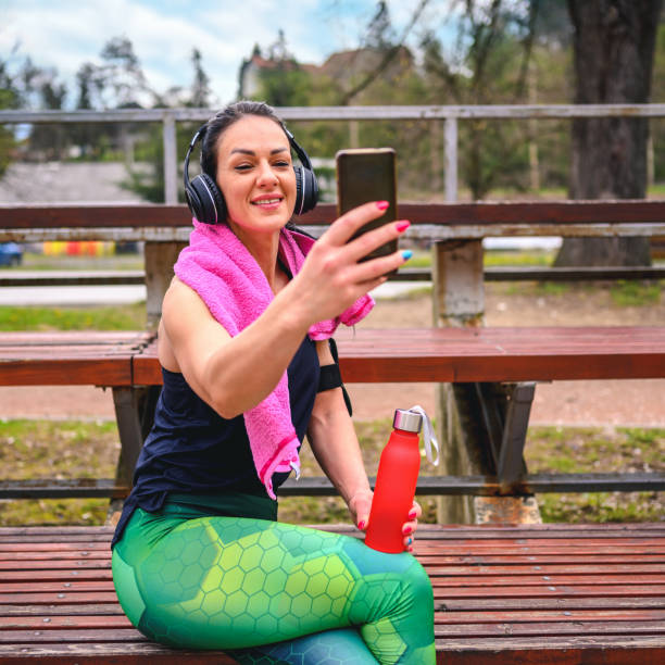 istock Woman taking a selfie on the stadium after the training 1313835864