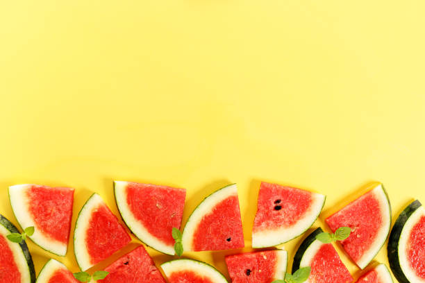 istock Sliced watermelon on yellow background, top view 1313835891