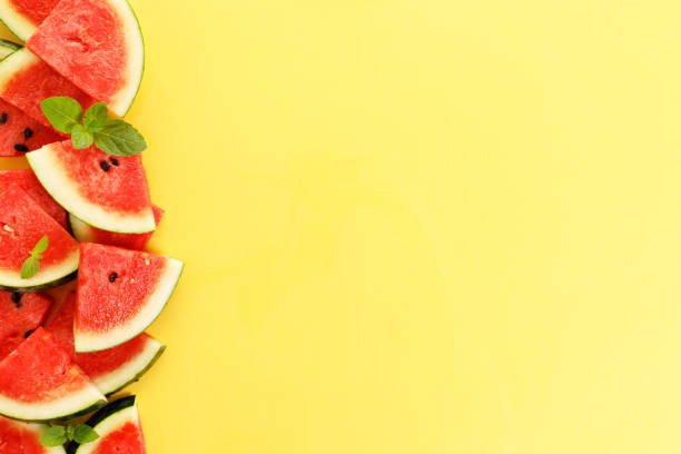 istock Sliced watermelon on yellow background, top view 1313835896
