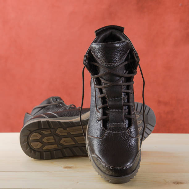 istock Pair of brown hiking boots 1313837002