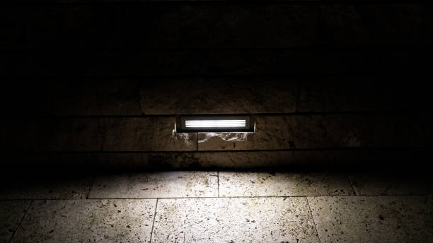 istock lamp between the rocks in the darkness 1313838356