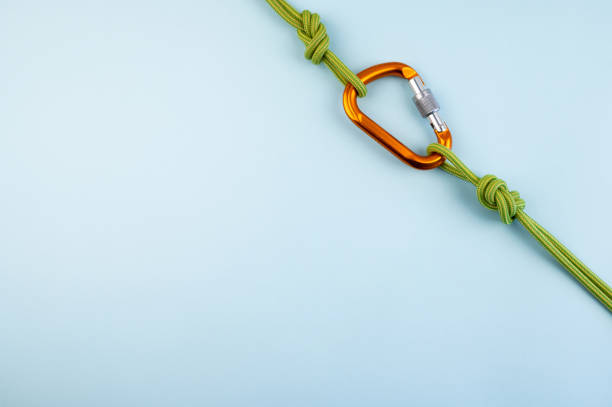 istock Carabiner with the rope isolated on the backgorund. 1313838946