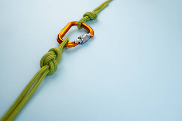 istock Carabiner with the rope isolated on the backgorund. 1313838963