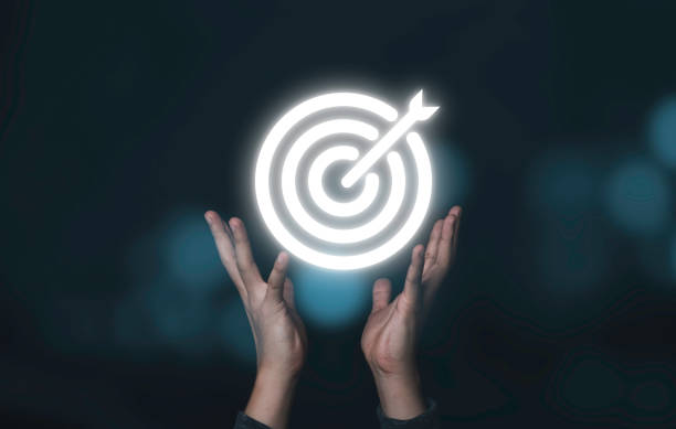 istock Two hands holding virtual white target board with arrow,Business Achievement objective target concept. 1313839016