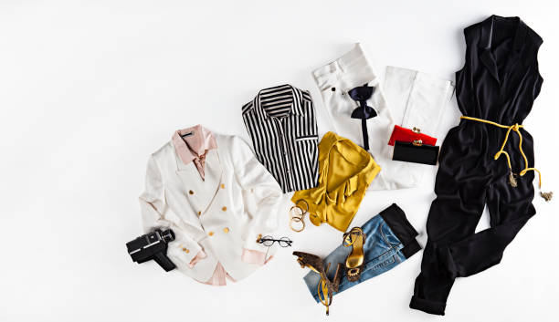 Women's clothing with personal accessories on white background