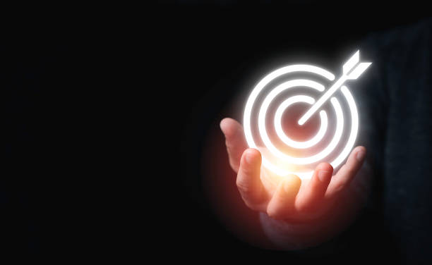 istock Businessman holding virtual dartboard with arrow ,Business Achievement objective target concept. 1313840424