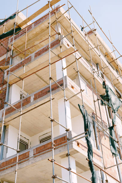 istock Scaffolding around the building under construction. Bottom view 1313841316
