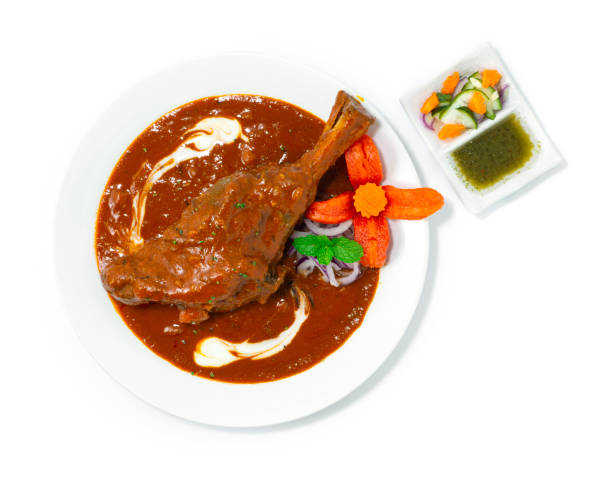 ラムシャンクマサラカレーの煮込み - lamb shank dinner meal ストックフォトと画像