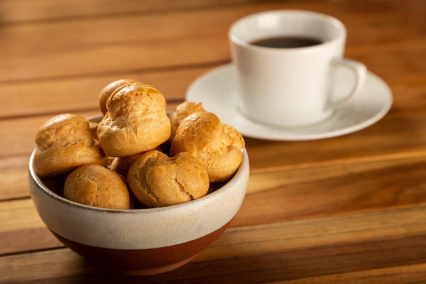 istock Delicious profiteroles with coffee on the table. 1313841543
