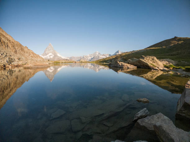 istock Perfect reflection of the Matterhorn on lake surface 1313846972