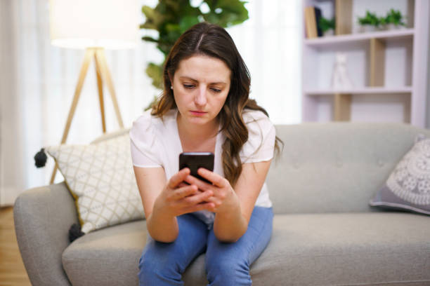 istock A Young woman sending text message with smartphone 1313847317