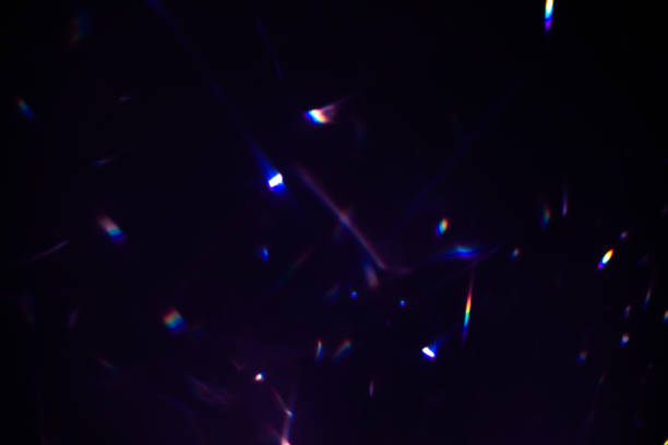 istock colorful warm rainbow crystal light leaks on black background 1313847586