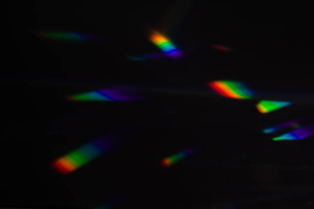 istock colorful warm rainbow crystal light leaks on black background 1313847687