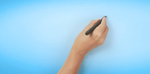 istock Hand is ready for drawing  black marker 1313848988