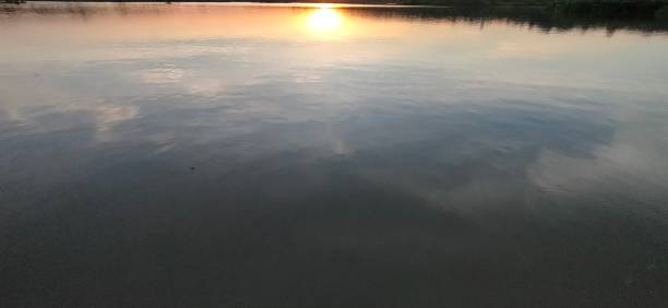 istock Sunset with country lake 1313851062