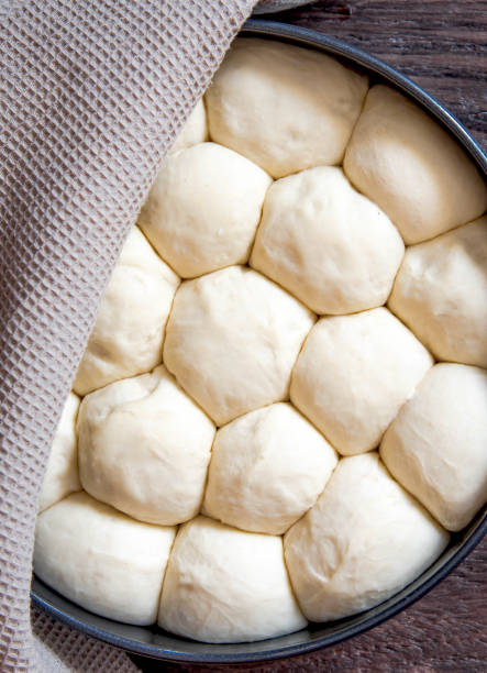 istock Raw yeast dough rises in a frying pan before baking 1313851888
