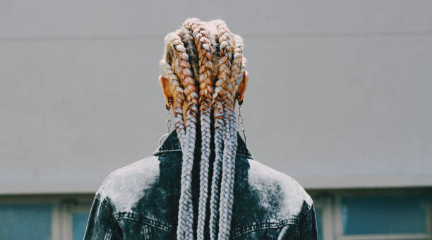 istock Rearview shot of a woman with cornrows posing outside 1313851959