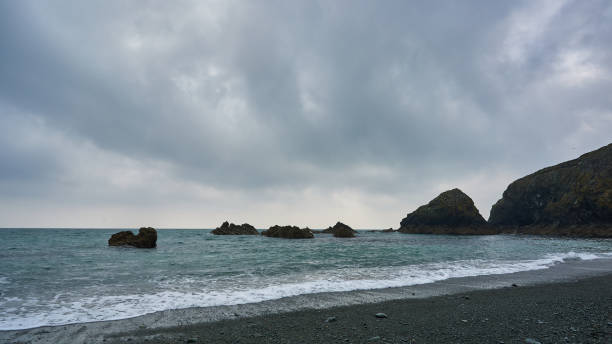 istock Tra na mBo beach in Ireland. long Irish beach with waves and strong cloudy sky. panoramic format 1313852626