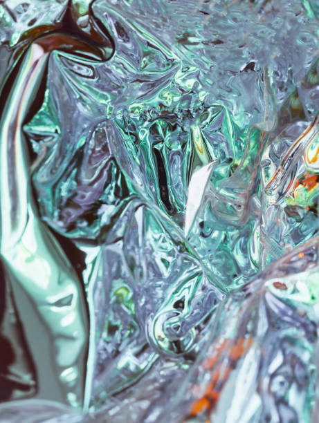 istock Abstract background shiny crumpled hologram with sparkles. Trendy neon textured background 1313854810