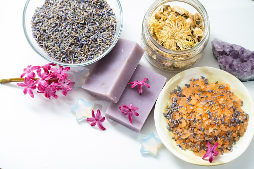 Organic aromatic sea salt, dried lavender and chrysanthemum in glass jars, amethyst crystals, handmade soap