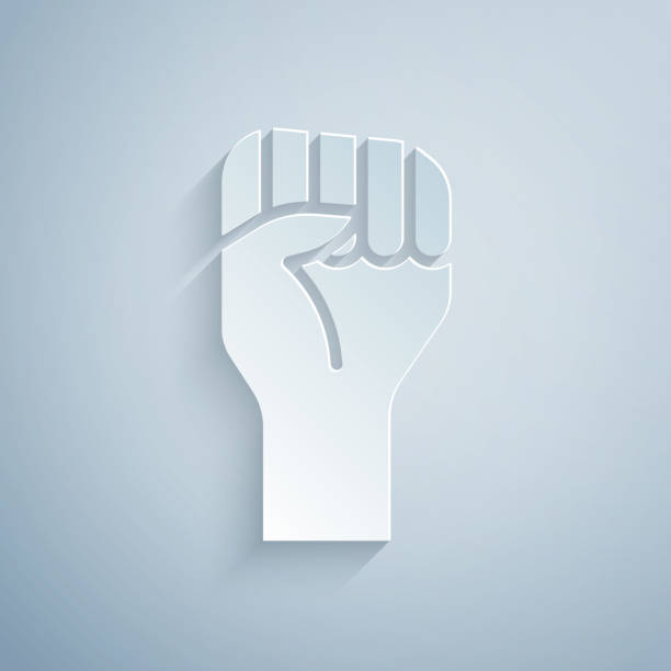 istock Paper cut Raised hand with clenched fist icon isolated on grey background. Protester raised fist at a political demonstration. Empowerment. Paper art style. Vector 1313855067