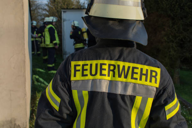 istock Volunteer firefighter with jacket and helmet 1313858317