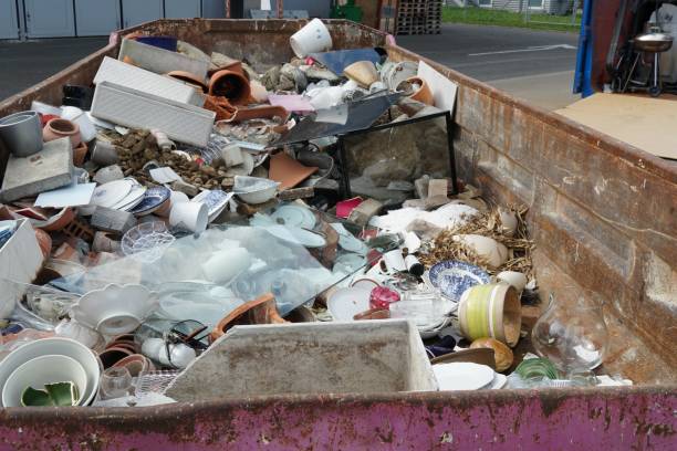 istock Mixed miscellaneous domestic  waste collected in a container in a community disposal place. 1313859000