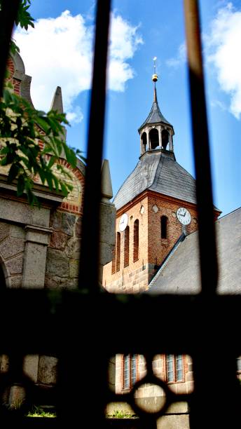 istock Church through fence 1313862080