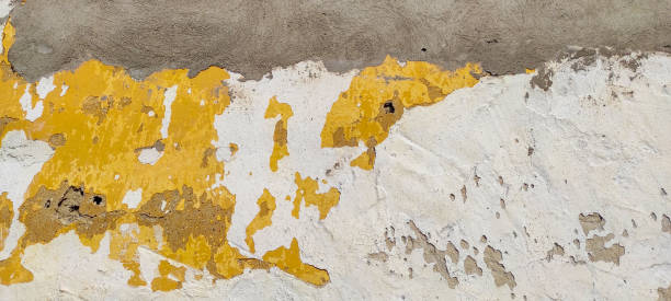 istock Yellow color dirty demaged concrete surface, aged wall structure, empty blank grunge horizontal background 1313868098