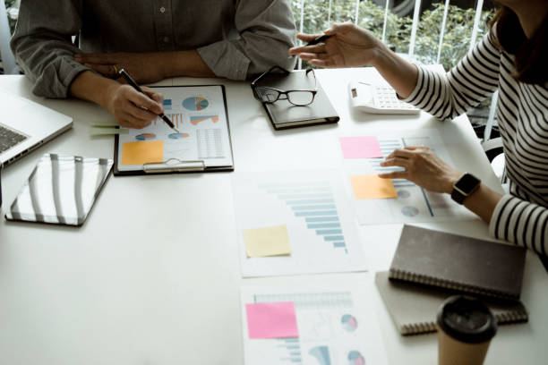 istock Businessman meeting in the office with graph introduction chart to be the information 1313871114