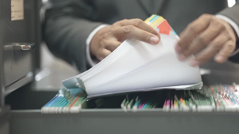 Businessman searching documents at the office