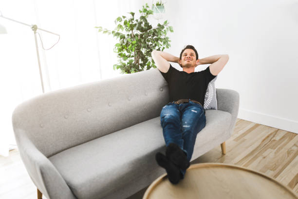 istock A Relaxing man and dreaming on sofa at home 1313877128