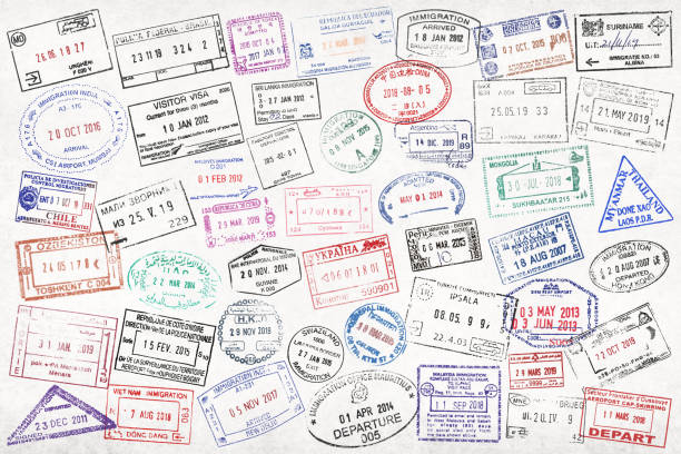 Close-up on a bunch of passport stamps from around the world.