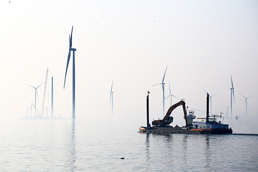Construction of new wind turbines at the Ijsselmeer, Breezanddijk, Holland