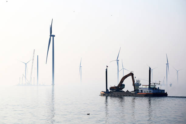 Offshore wind turbines Construction of new wind turbines at the Ijsselmeer, Breezanddijk, Holland offshore wind farm stock pictures, royalty-free photos & images
